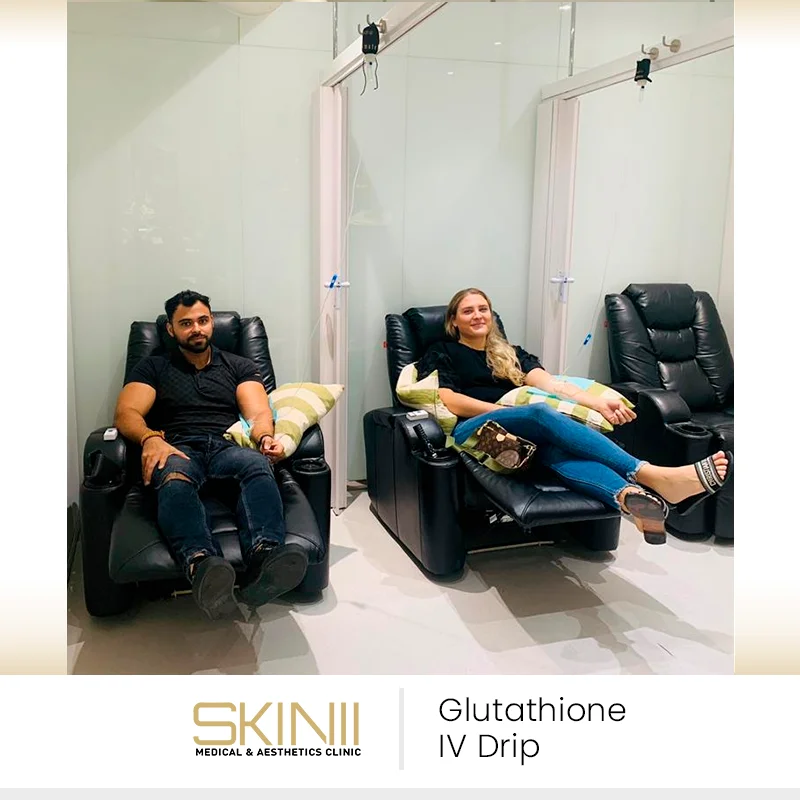 Clients relaxing in recliners while receiving glutathione IV drip therapy at Skin111 Medical & Aesthetics Clinic in Dubai.